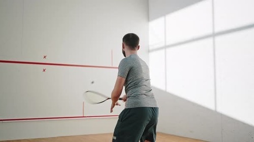 Videohive - Athlete in Good Shape Hits Ball with Racket Against Wall 41146966